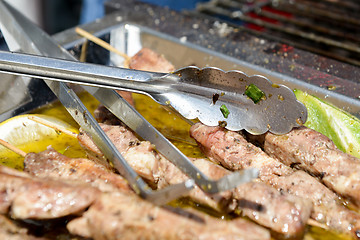 Image showing Juicy roasted kebabs on the metal tray