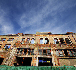 Image showing Facade of old destroyed house. Wide-angle view.