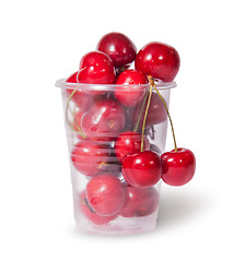 Image showing Red juicy sweet cherries in a plastic cup