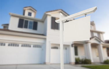 Image showing Blank Real Estate Sign in Front of New House 