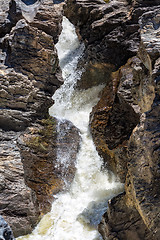 Image showing Waterfall Flowing Between the Lava Stones