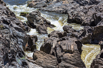 Image showing Waterfall Flowing Between the Lava Stones