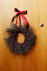 Image showing wooden door with a Christmas wreath