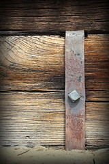 Image showing metal mount on old wooden beam