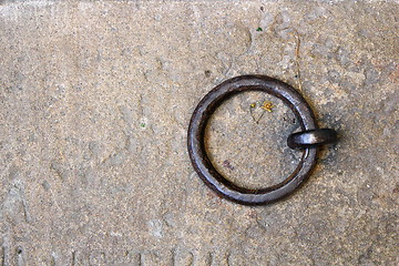 Image showing metal ring on tomb