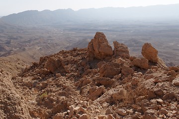 Image showing Jagged  rocks at the rim of desert canyon in the Small Crater (Makhtesh Katan) in Negev desert, Israel