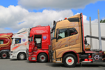 Image showing Lineup of Colorful Volvo and Scania Trucks