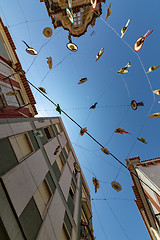 Image showing City Streets Decorated with Straw Hats