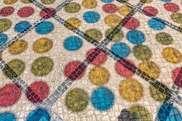 Image showing Multicolored Shadows from Decorative Balls on Paving Stone