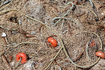 Image showing Pile Fishing Net with Red Floats