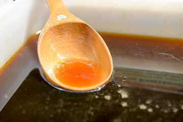 Image showing natural chestnut honey of dark brown color