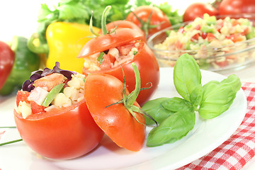 Image showing Tomatoes stuffed with pasta salad and basil