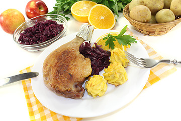 Image showing delicious Duck leg with red cabbage