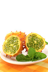 Image showing horned melon on a plate with napkin