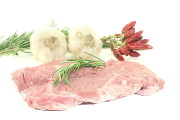 Image showing raw Ribeye steak with garlic and rosemary