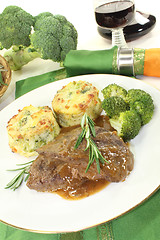 Image showing Venison medallions with rosemary branch