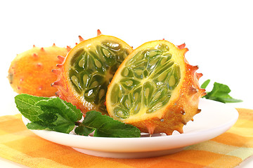 Image showing sliced horned melon with napkin