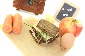 Image showing sandwich eaten during break with egg and carrots