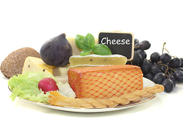 Image showing Pieces of cheese with blackboard