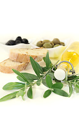 Image showing Bottle of olive oil with olives