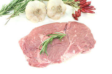 Image showing fresh raw Ribeye steak with rosemary