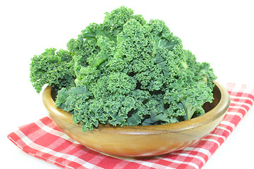 Image showing Kale in a wood bowl on napkin