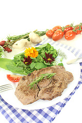 Image showing fresh Sirloin steak with wild herb salad