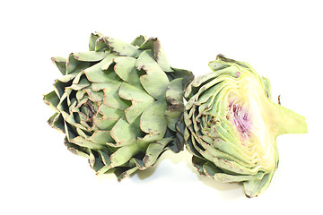 Image showing sliced and whole artichokes