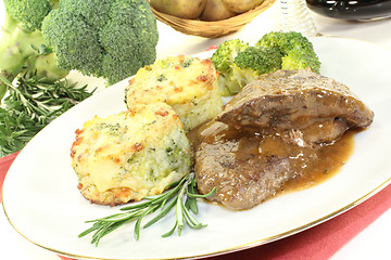 Image showing Venison medallions with potato gratin and broccoli