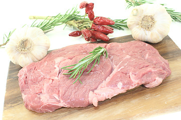 Image showing Ribeye steak with garlic and rosemary