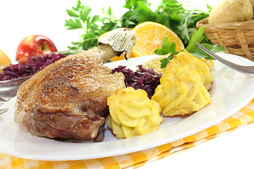 Image showing Duck leg with red cabbage
