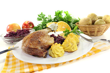 Image showing fresh Duck leg with red cabbage