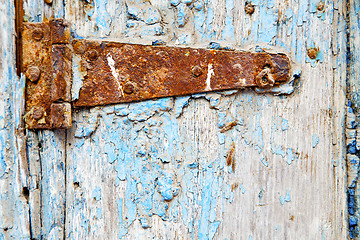 Image showing morocco in  old wood  facade home and rusty safe padlock 