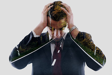 Image showing double exposure of depressed business man and road in nature