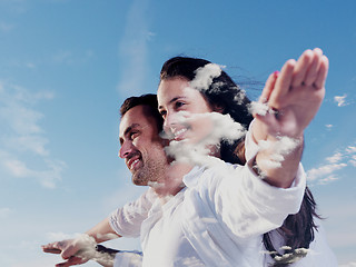 Image showing double exposure of young couple  cloudes