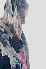 Image showing double exposure of  business man with  mobile phone and mountain