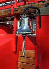 Image showing Metal alarm bell on red fire truck