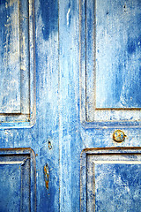 Image showing dirty stripped   in the blue wood door  