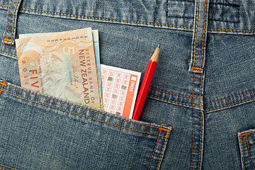 Image showing New Zealand money and lottery bet slip in pocket