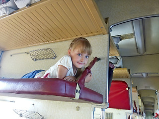 Image showing Little girl traveling in carriage