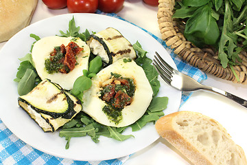 Image showing Courgette rolls and filled mozzarella with arugula