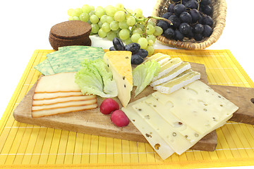 Image showing Slices of cheese with grapes