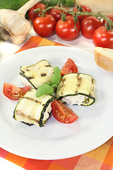 Image showing fresh delicious stuffed courgette rolls