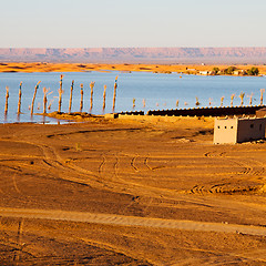 Image showing sunshine in the lake yellow  desert of morocco sand and     dune