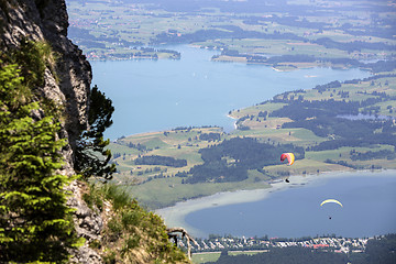 Image showing  Paragliders flying over Bavarian lake Forggensee