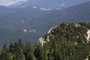 Image showing Paraglider flying over Bavarian mountains