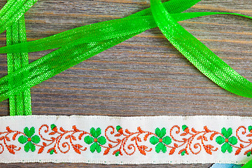 Image showing vintage embroidered band and green tape