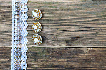 Image showing three vintage button and lace tape