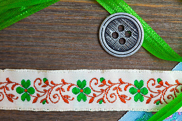 Image showing vintage ribbons, tape and one classic button 