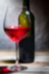 Image showing red wine in a glass and green bottle